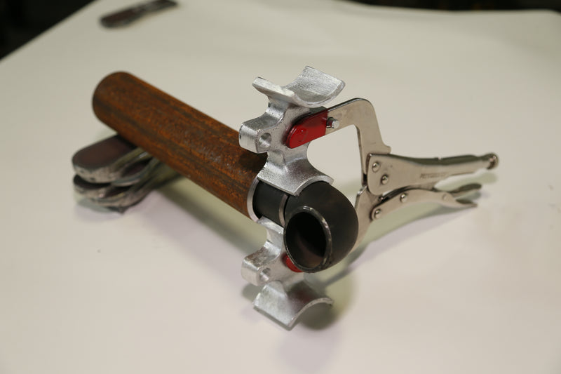 Welders 3rd Hand holding pipe, studio white