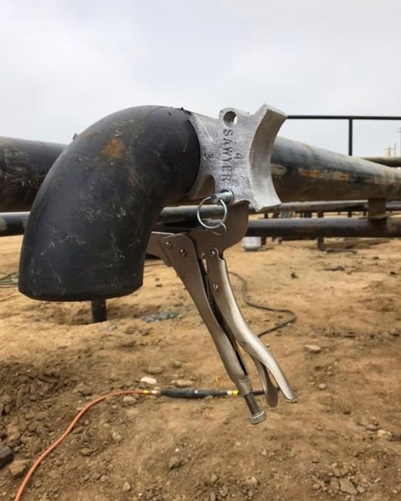 Welders 3rd Hand holding an elbow in the field